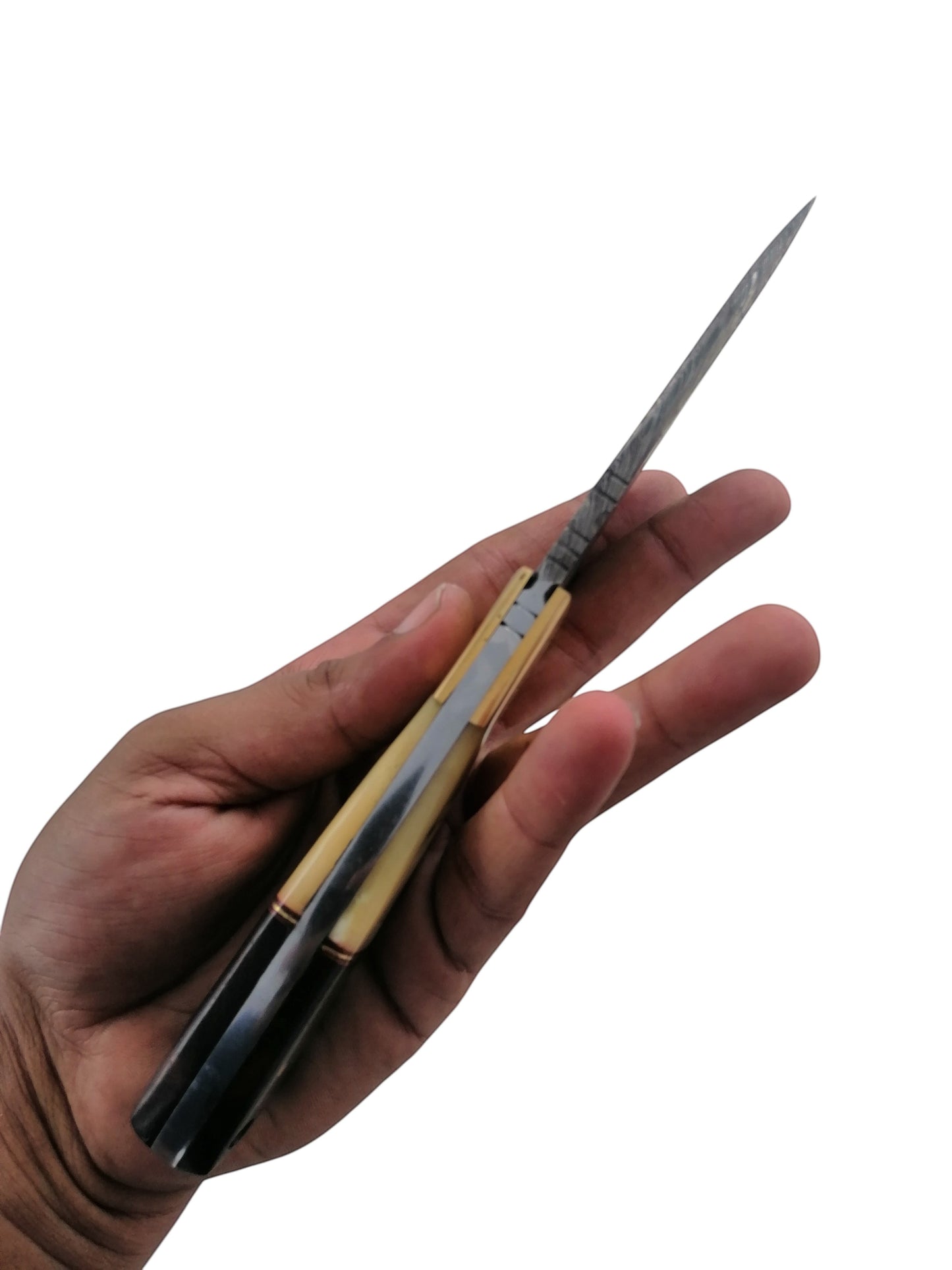 SUSA KNIVES handmade damascus steel skinner knife with a two-tone handle held in a hand, side profile view.