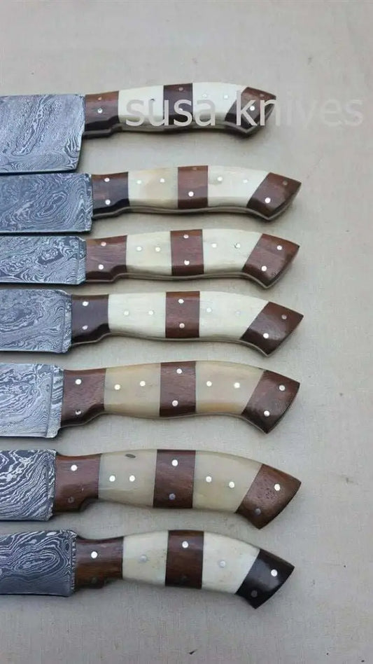Customized handmade Damascus 7-piece kitchen knife set with twisted steel blades and mixed wood handles