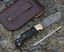 Load image into Gallery viewer, DAMASCUS FOLDING KNIFE, DAMASCUS POCKET KNIFE, CUSTOM DAMASCUS FOLDER, CLIP POINT BLADE, LOCK BACK FOLDING KNIFE, EXOTIC WENGE WOOD SCALES, HAND CARVED SPINE, LANYARD HOLE, HAND STITCHED LEATHER SHEATH - SUSA KNIVES
